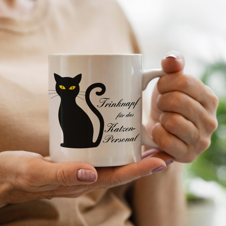In der Hand gehaltene MotivMonster-Tasse - Trinknapf für das Katzenpersonal